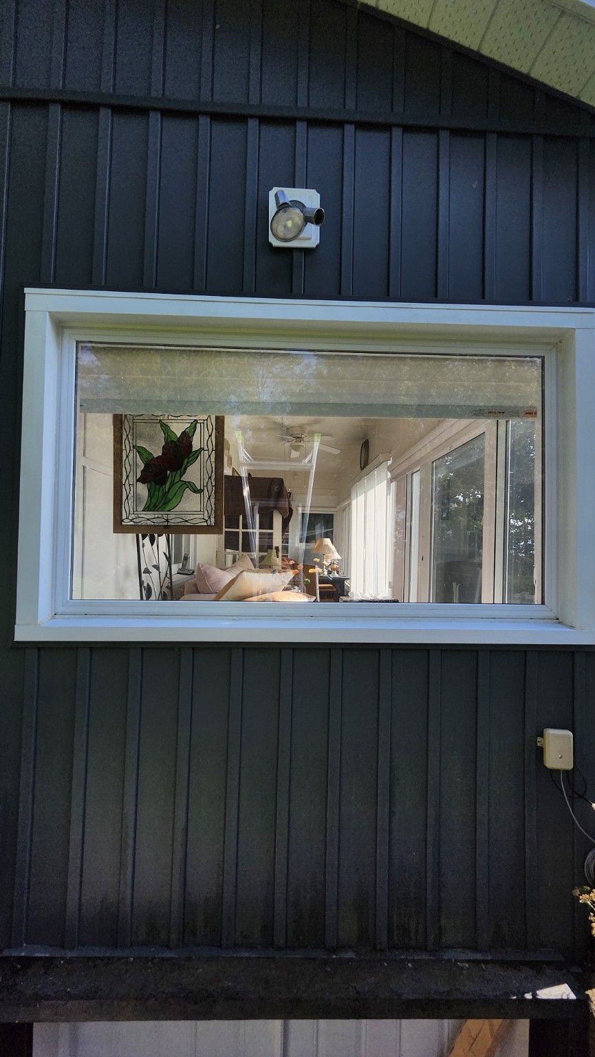 After window cleaning: refreshed white window frame, sill and glass